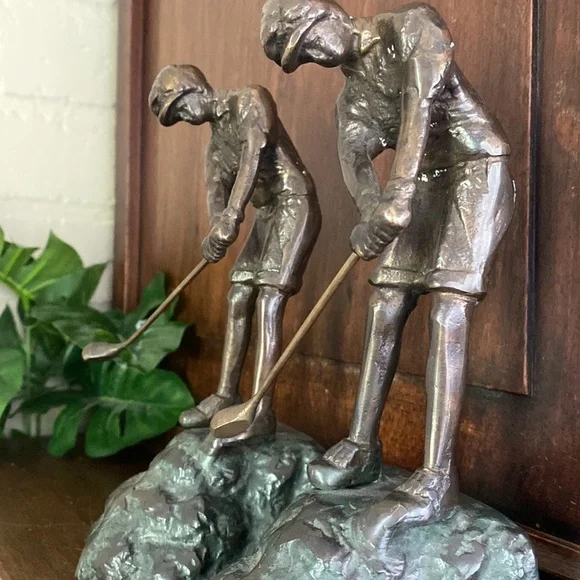 Cast‎ metal bookends golfers